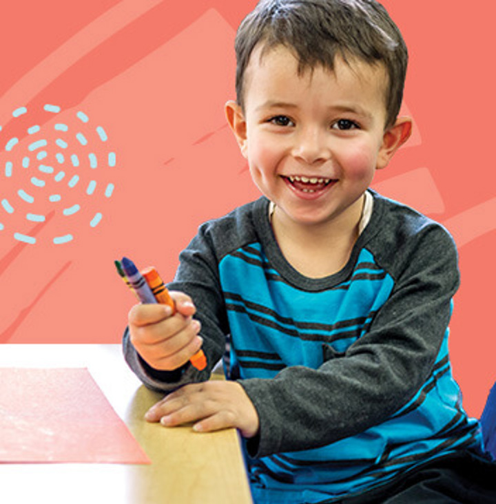 Preschool child with crayons